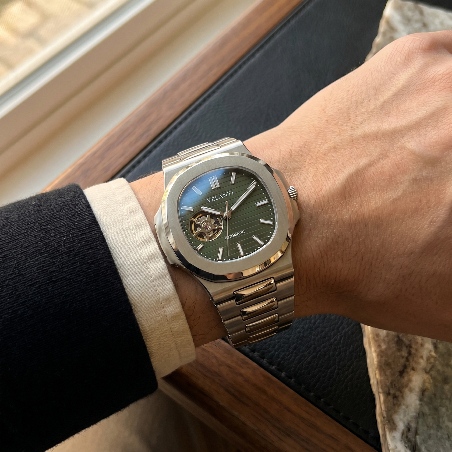 Nautilus-style custom mod watch, Velanti Milano Nautvel Olive Green Open Movement worn on wrist photo 9