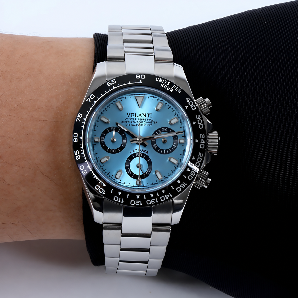 Velanti Milano Veltona Ice Blue, Daytona-style watch with a Seiko movement, blue-dial watch on wrist by black sleeve